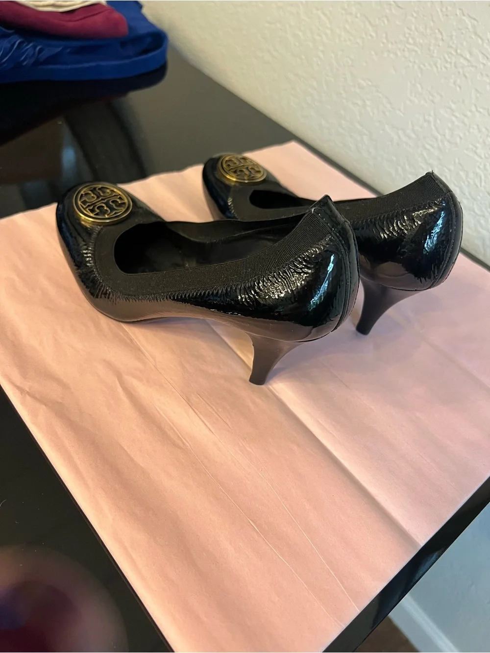 Tory Burch Black Patent Logo Round-Toe Pumps with Gold Emblem